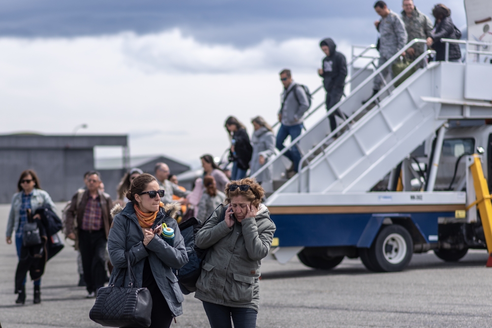 Relatives of people aboard the Chilean Air Force C-130 Hercules cargo plane that went missing in the sea between the southern tip of South America and Antarctica, arrive at Chabunco army base in Punta Arenas, Chile, on December 11, 2019. AFP / Joel Estay
