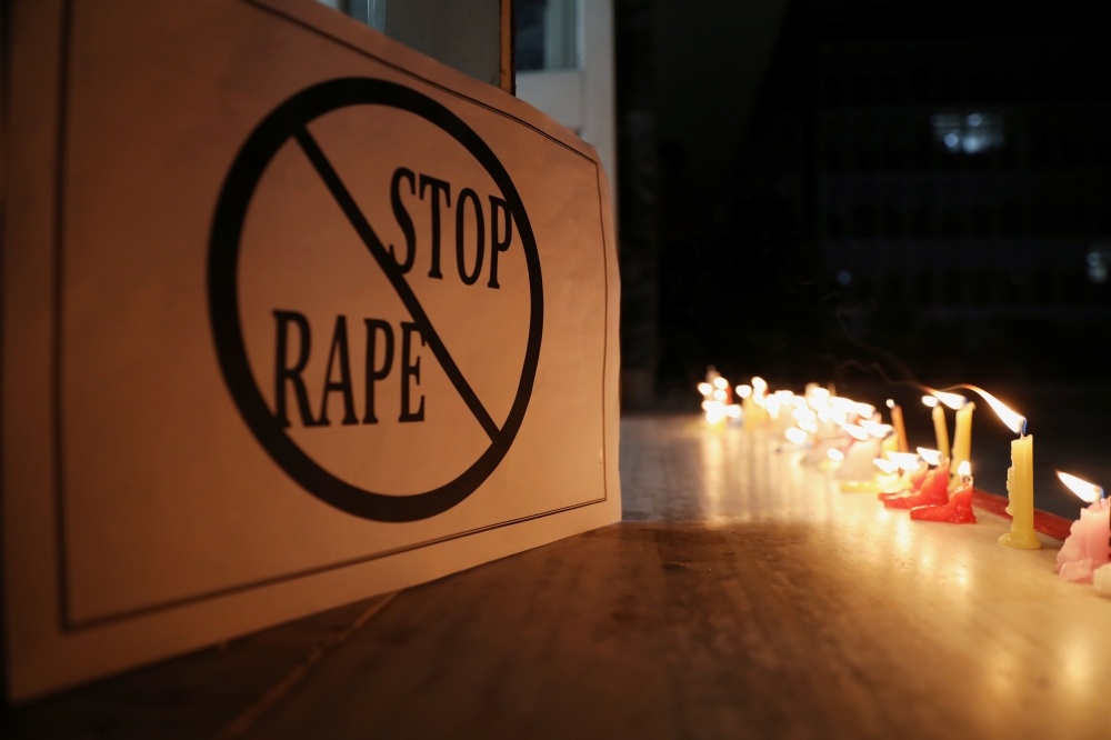 A poster is seen at a candle march by the doctors from AIIMS, New Delhi, to protest against the rape-murder of a 27-year-old woman in Hyderabad, India, December 3, 2019. Reuters / Anushree Fadnavis
 