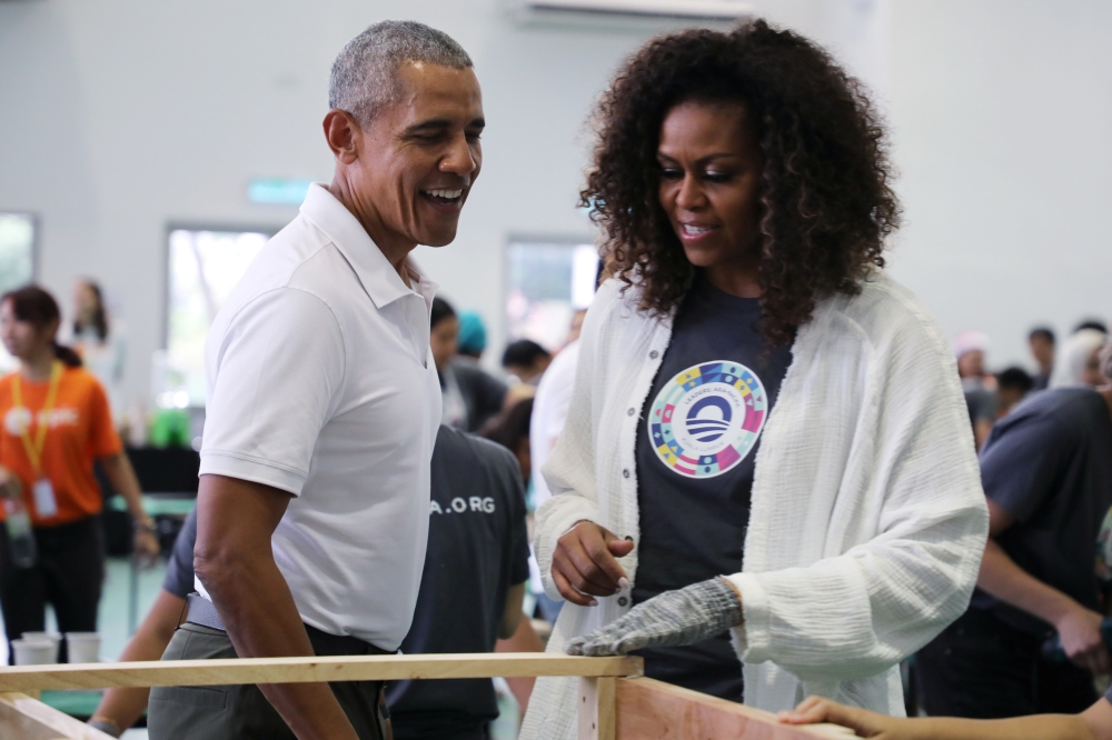 Former US President Barack Obama and former first lady Michelle Obama attend a community service project in Petaling Jaya, Malaysia, December 12, 2019. Reuters/Lim Huey Teng
 