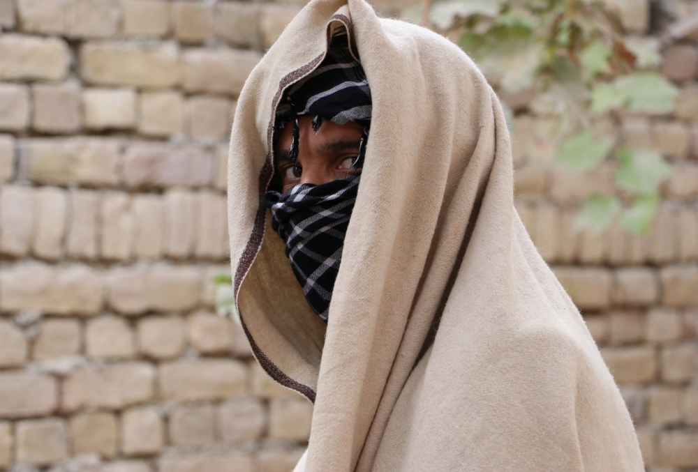 FILE PHOTO: Nineteen-year-old Taliban deserter hides his face in Kunduz province, Afghanistan December 4, 2019. Picture taken on December 4, 2019. REUTERS
