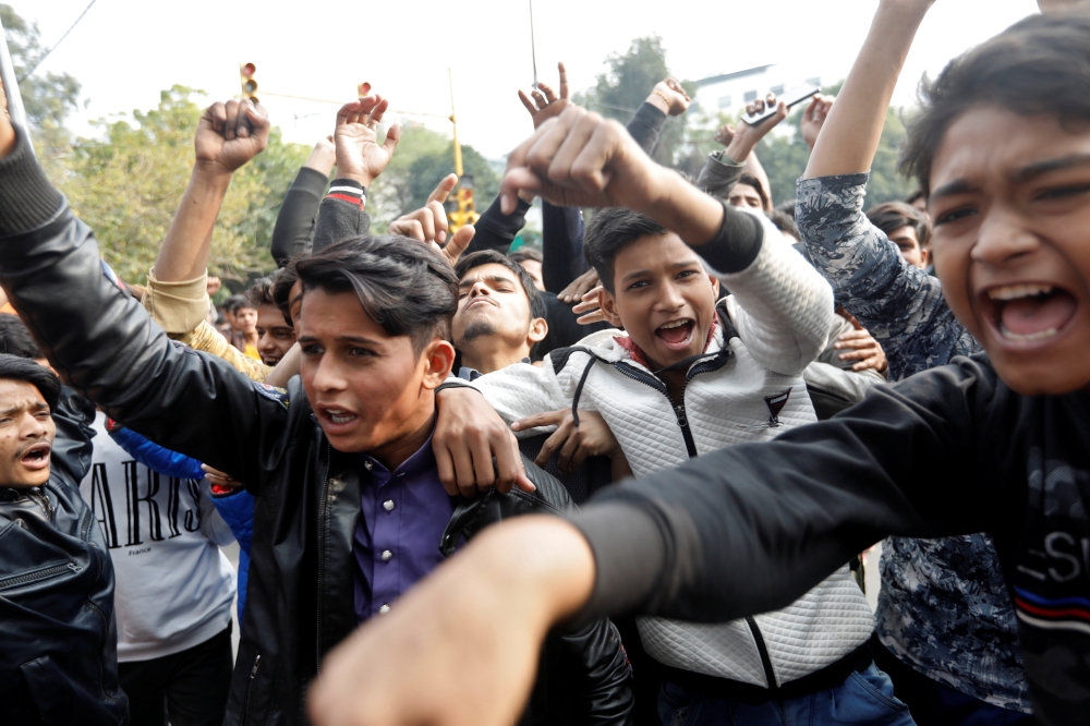 Demonstrators shout slogans during a protest against a new citizenship law, in New Delhi, India, December 15, 2019. REUTERS/Adnan Abidi