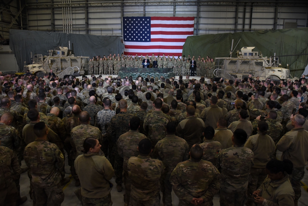 (FILES) In this file photo taken on November 28, 2019 US President Donald Trump speaks to the troops during a surprise Thanksgiving day visit at Bagram Air Field, in Afghanistan. AFP / Olivier Douliery