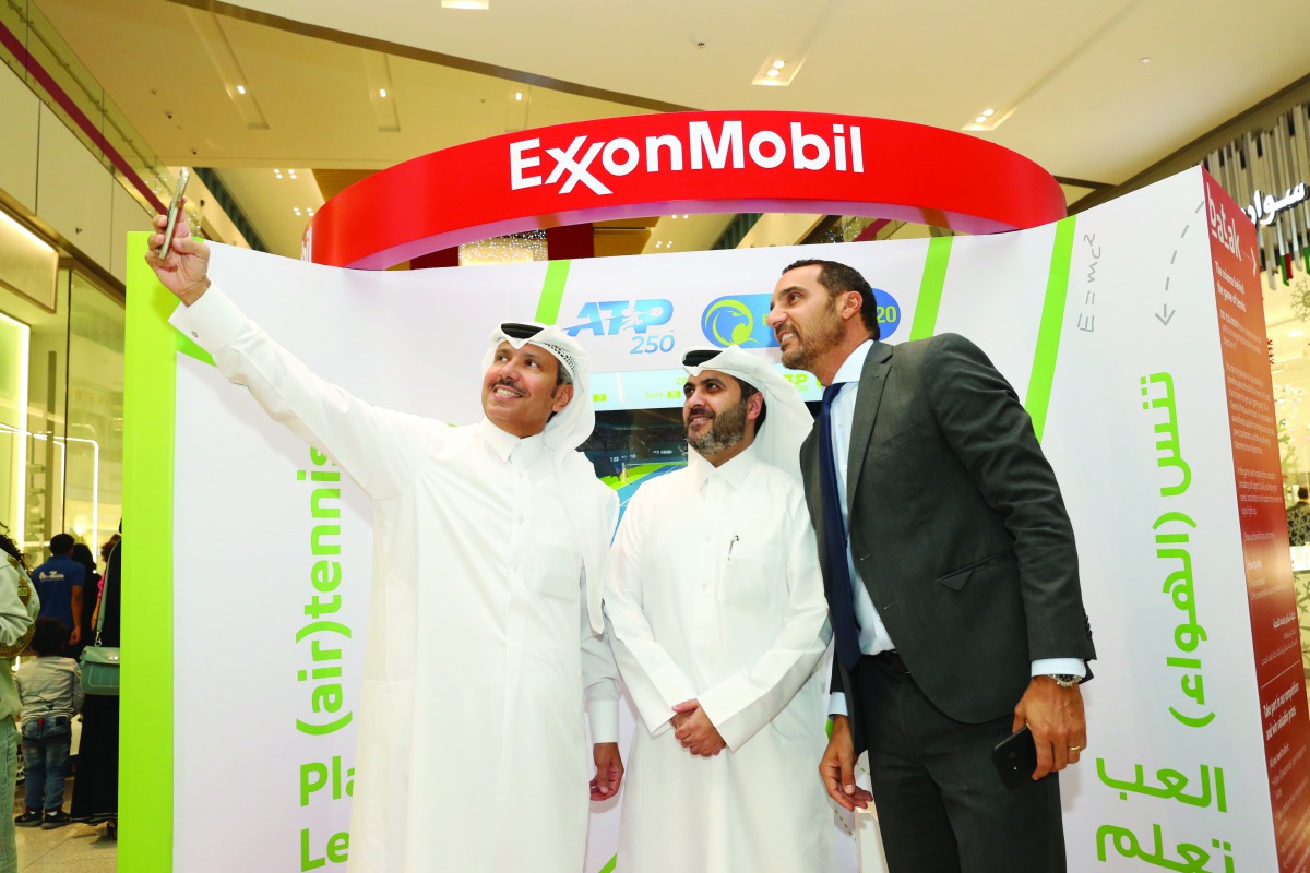 Saleh Al Mana, Vice President and Director of Government and Public Affairs for ExxonMobil Qatar, takes a selfie with Tareq Zeinal (centre), Secretary General Assistant of Qatar Tennis Federation;  and Karim Alami, Tournament Director during the launch of