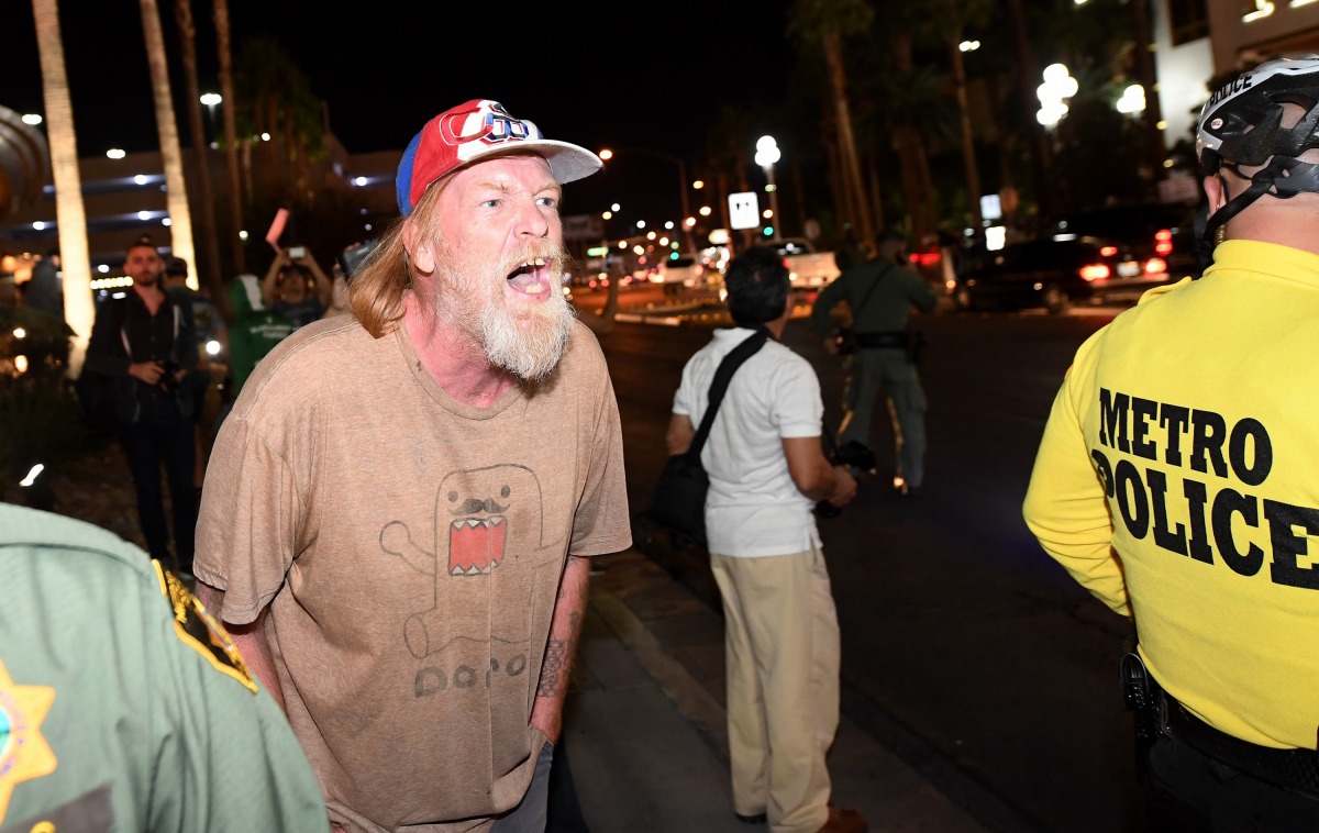 File photo of a Trump supporter yells at anti-Trump protesters outside the Trump International Hotel in Las Vegas. Ethan Miller / Getty Images / AFP