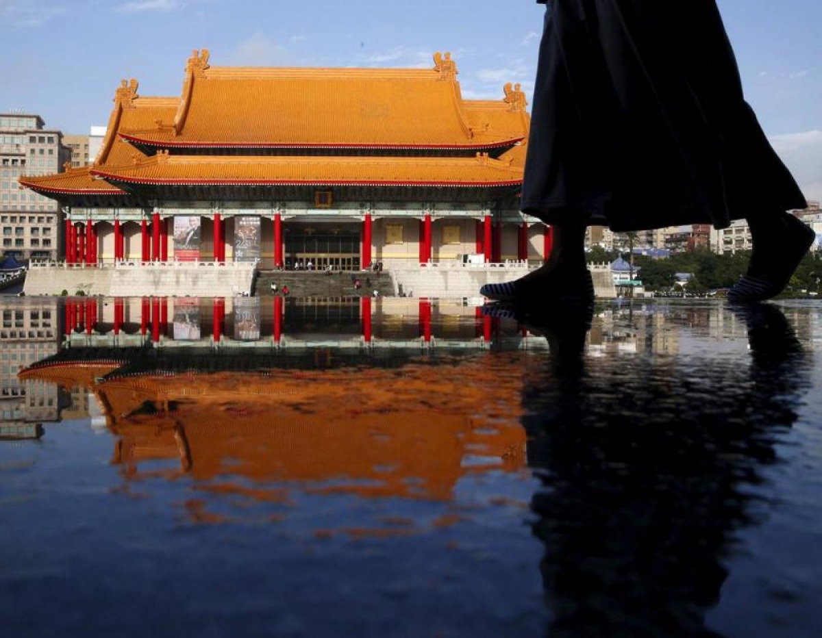 A woman walks past the the National Concert Hall in Taipei, Taiwan, January 17, 2016. Reuters/Olivia Harris