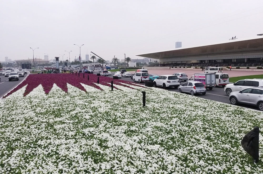 Qatar National Flag with 250,000 flower plants is seen in front of the main podium for the celebrations of Qatar National Day on the Corniche.