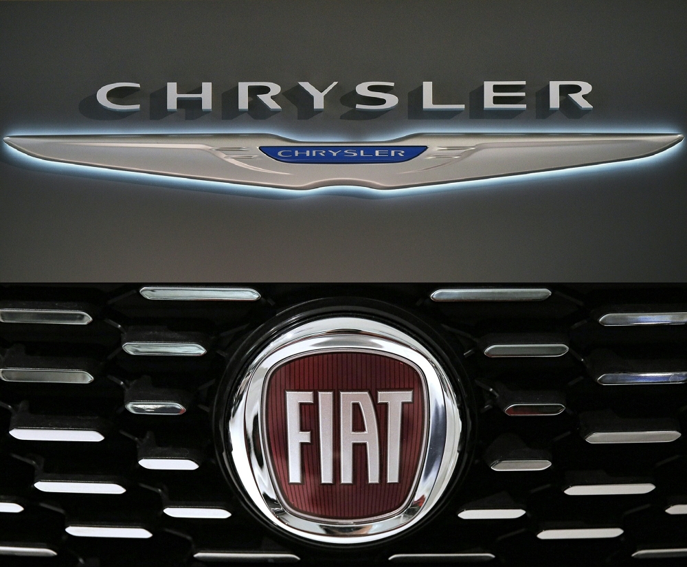 This combination of file pictures shows a Chrysler logo and a logo of Fiat. (AFP / Mandel Ngan and Marco Bertorello)