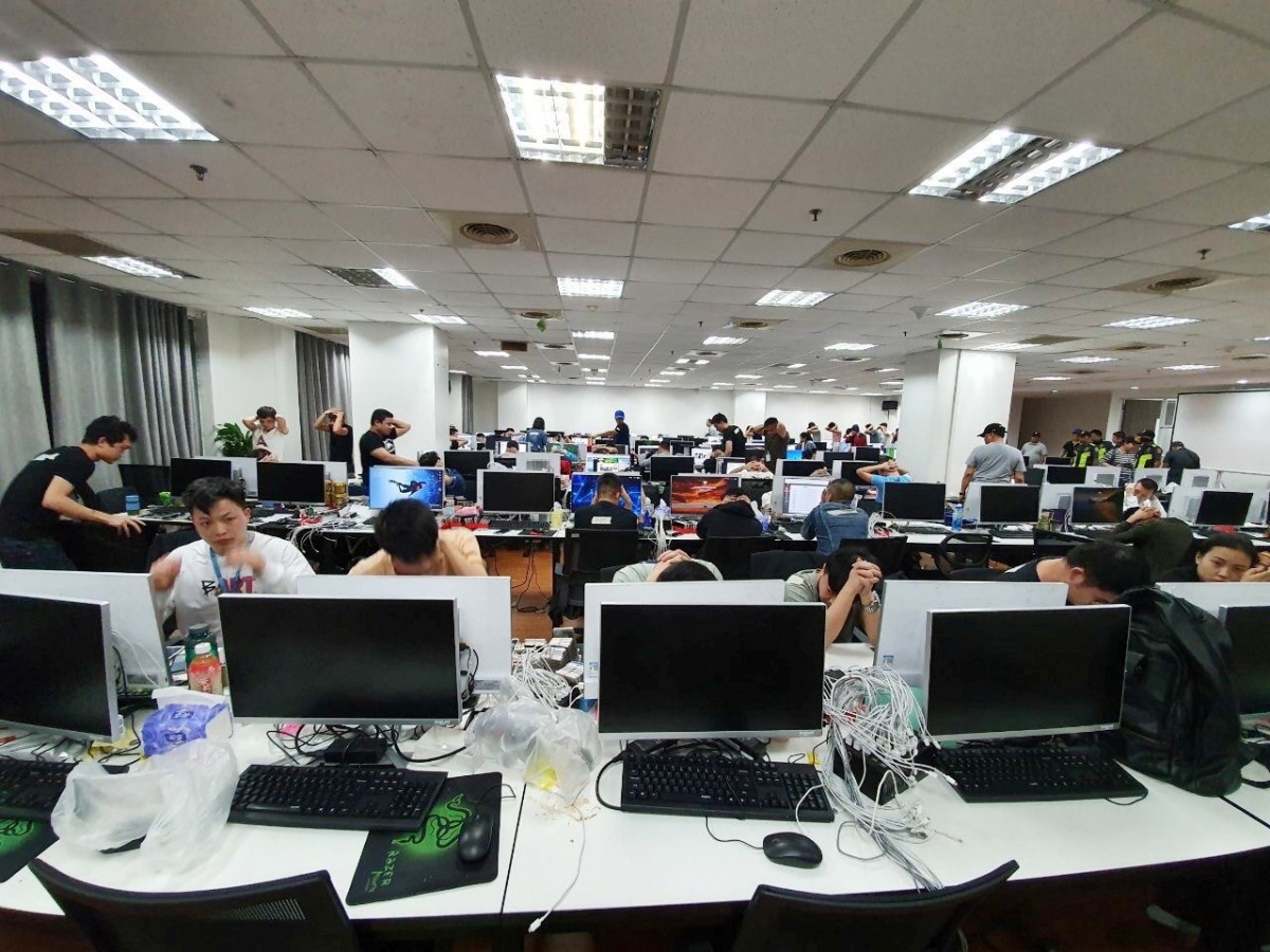 Chinese workers illegally working at an unlicensed online gambling firm are arrested by Philippine authorities at an office building in Quezon City, Metro Manila, Philippines, December 19, 2019. Picture taken December 19, 2019. Bureau of Immigrations/Hand
