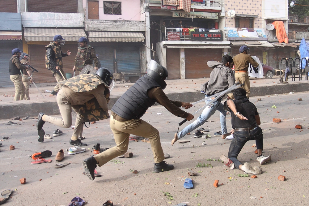 Police clash with protesters during demonstrations against India's new citizenship law in Lucknow on December 19, 2019. (AFP)