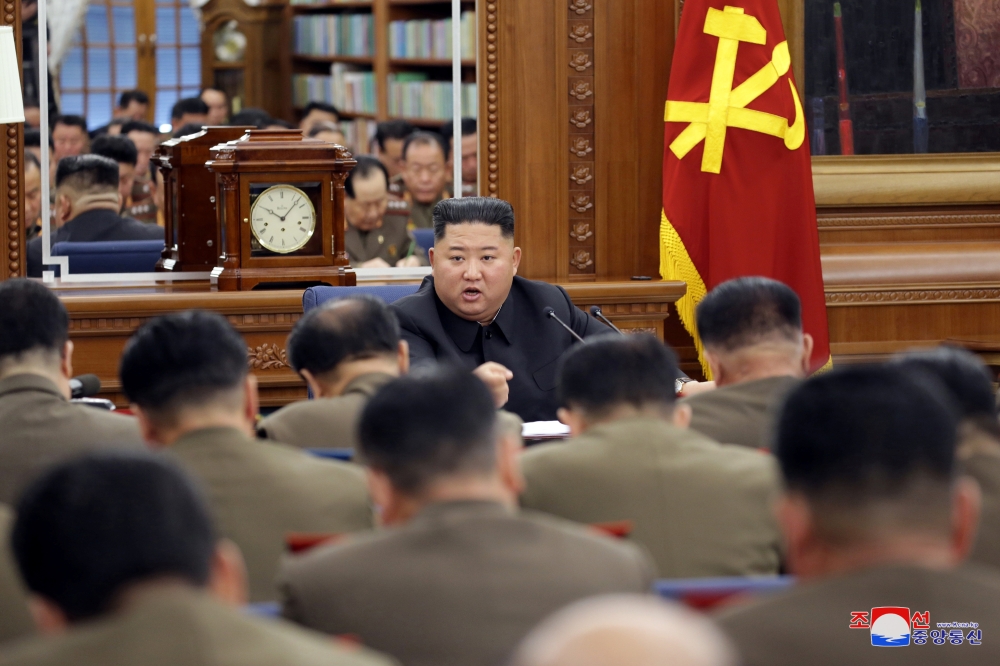 North Korean leader Kim Jong Un speaks during the Third Enlarged Meeting of the Seventh Central Military Commission (CMC) of the Workers' Party of Korea (WPK) in this undated photo released on December 21, 2019. KCNA via REUTERS