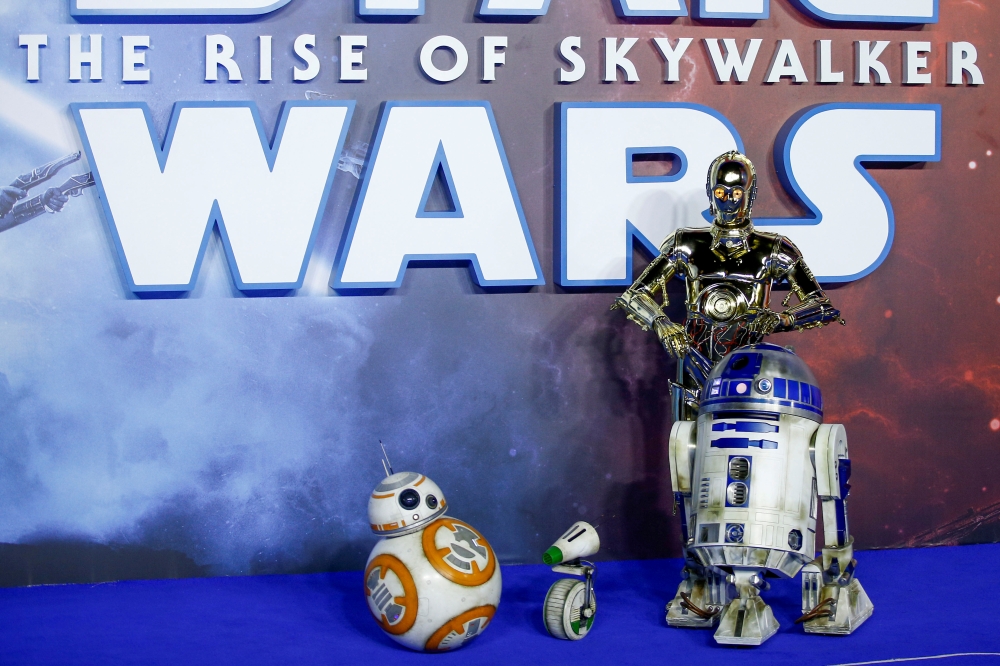 Star Wars robots pose as they attend the premiere of 