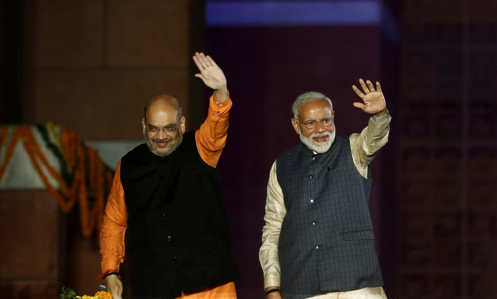 Indian Prime Minister Narendra Modi and Bharatiya Janata Party (BJP) President Amit Shah wave towards their supporters after the election results at party headquarter in New Delhi, India, May 23, 2019. Reuters/Adnan Abidi 