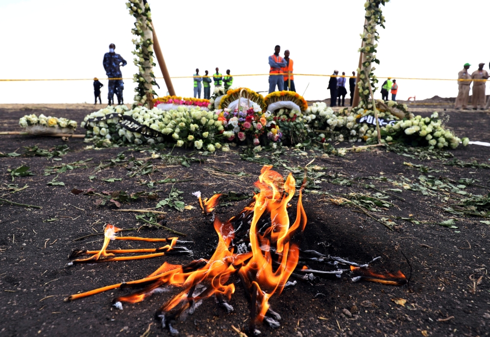 Candle flames burn during a commemoration ceremony for the victims at the scene of the Ethiopian Airlines Flight ET 302 plane crash near the town Bishoftu, March 14, 2019. Reuters / Tiksa Negeri