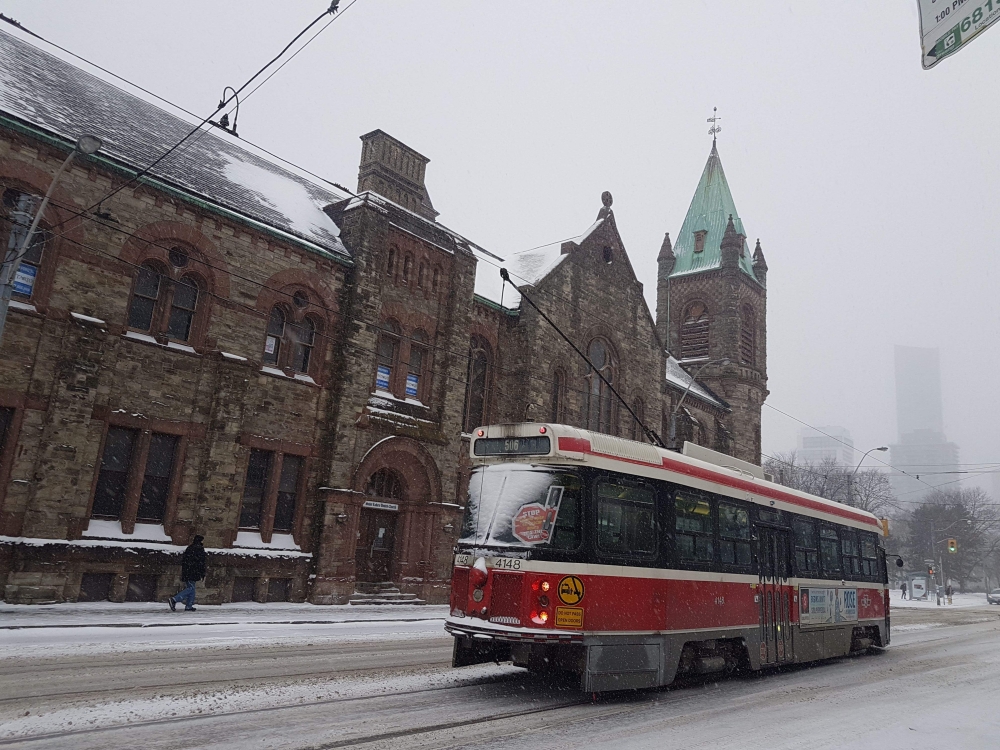 A streetcar travels a street in Toronto, Canada, December 7, 2019.  AFP / Olivier Monnier 