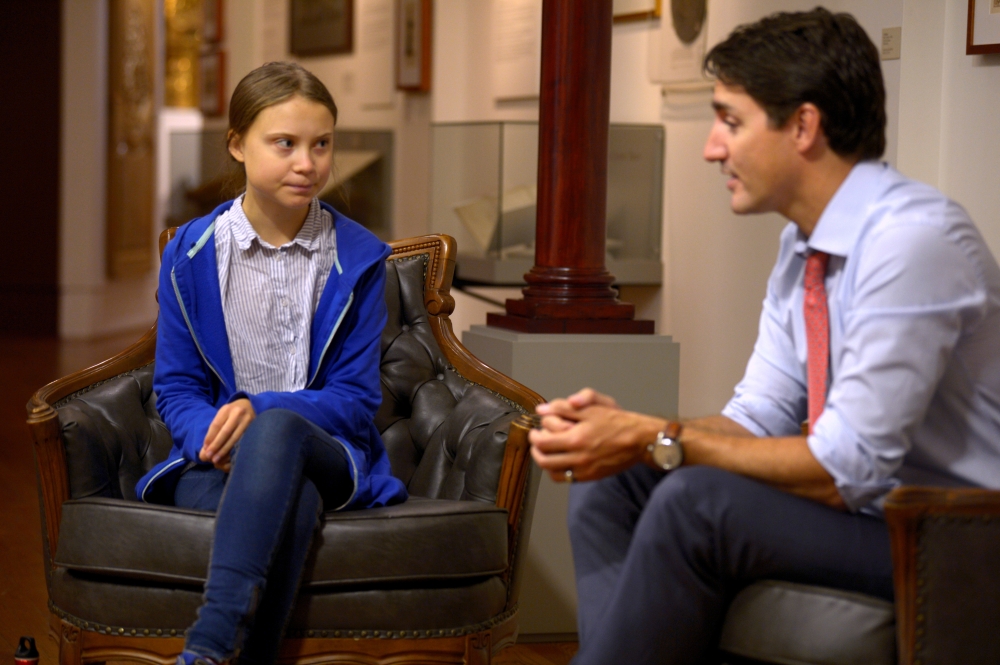 Prime Minister Justin Trudeau greets Swedish climate change teen activist Greta Thunberg before a climate strike march in Montreal, Quebec, Canada, September 27, 2019. Reuters / Andrej Ivanov