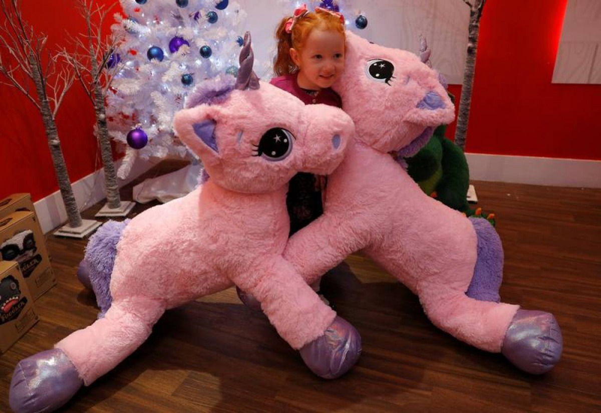 A girl plays with Unice Unicorn at the launch of Hamleys top Christmas toys launch in London, September 26, 2018. Reuters / Peter Nicholls