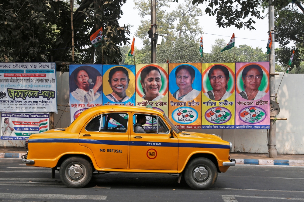 A taxi drives past a poster of Mamata Banerjee, the Chief Minister of West Bengal state, in Kolkata, February 9, 2019. Reuters / Rupak De Chowdhuri