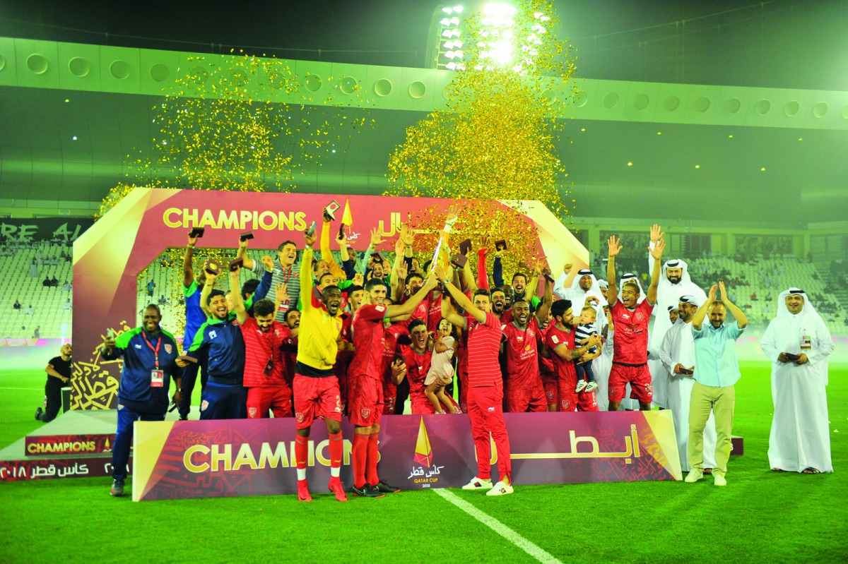 Al Duhail's players and officials celebrate after winning the 2018 Qatar Cup trophy in this file photo. 