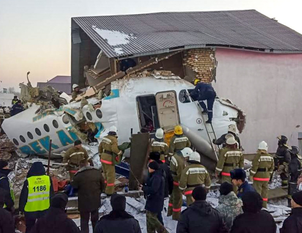 This handout picture taken on December 27, 2019 and released by Kazakhstan's emergencies committee shows resquers working at the site of a passenger plane crash outside Almaty. ( AFP / Kazakhstan's emergencies committee)