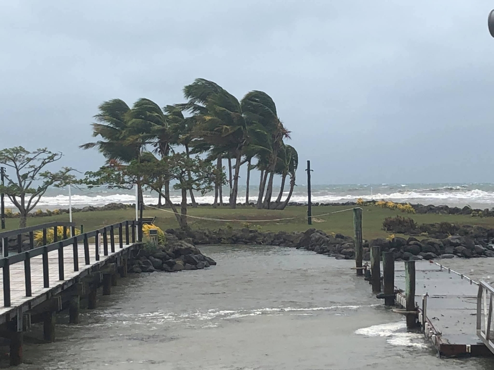 Trees buffeted by strong winds are seen near a beach during tropical cyclone Sarai in Viseisei, Fiji December 27, 2019 in this picture obtained from social media. Picture taken December 27, 2019. YOGACHARYA P R MOHANAN /via REUTERS 