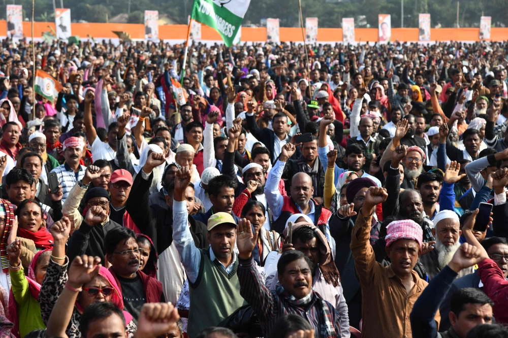 Congress Party activists and supporters shout slogans during a rally against India's new citizenship law, in Guwahati on December 28, 2019. (AFP / Jewel SAMAD)
