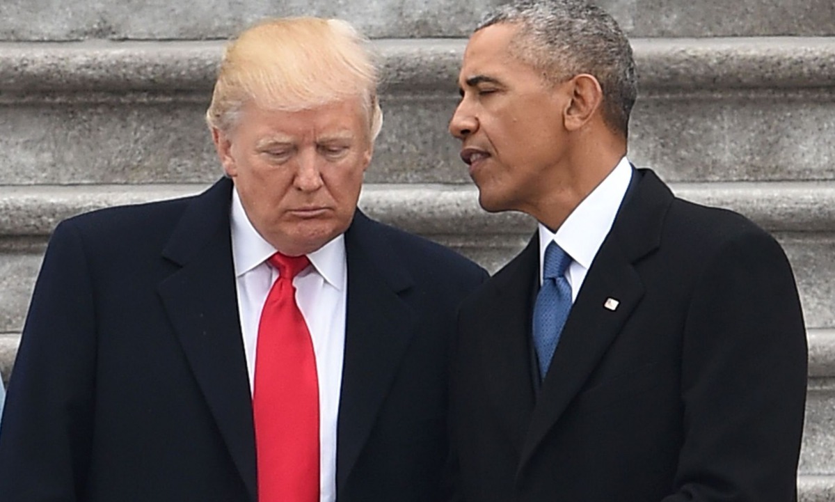 US President Donald Trump speaks to former President Barack Obama after inauguration ceremonies at the US Capitol on January 20, 2017, in Washington. AFP / Robyn Beck
