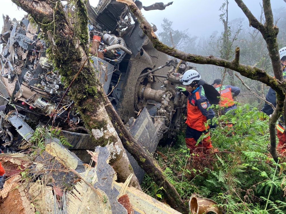 A rescue team searches for missing military officers, after a Black Hawk helicopter made a forced landing at a mountainous area near Taipei, Taiwan January 2, 2020. Yilan County Fire Bureau/Handout via REUTERS 