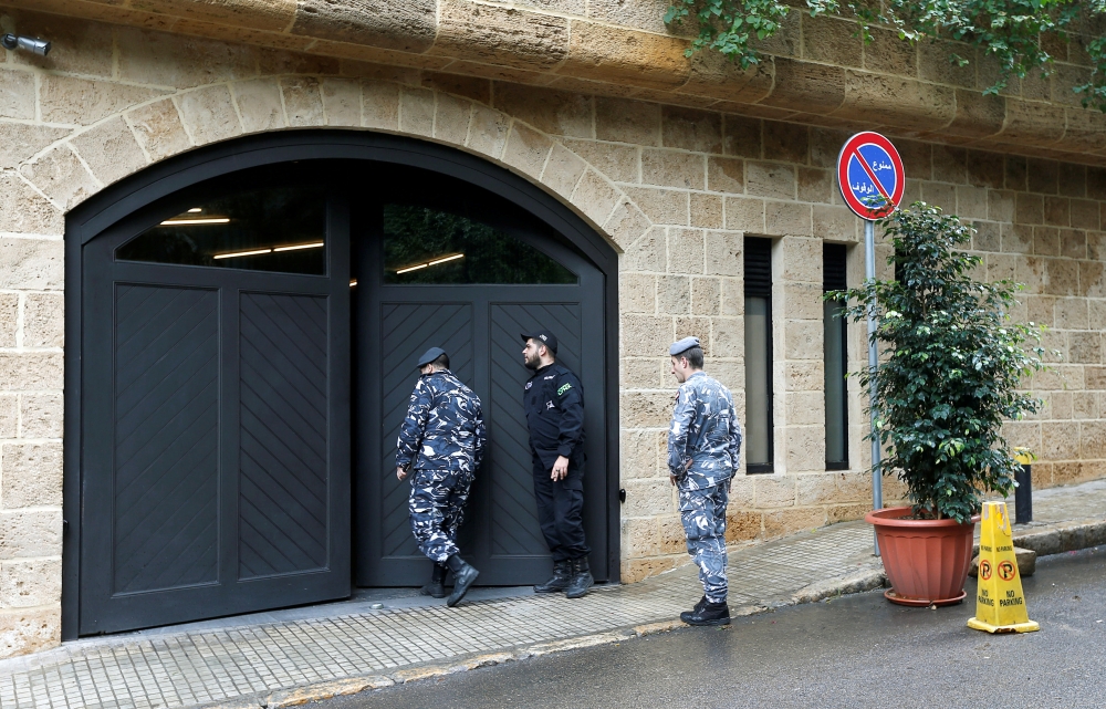 Lebanese police officers are seen at the entrance to the garage of what is believed to be former Nissan boss Carlos Ghosn's house in Beirut, Lebanon December 31, 2019. REUTERS/Mohamed Azakir