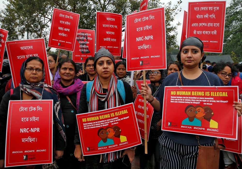 Demonstrators display placards as they attend a protest rally against a new citizenship law, in Kolkata, India, January 3, 2020. Reuters/Rupak De Chowdhuri


