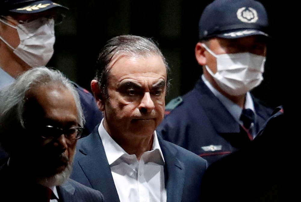 FILE PHOTO: Former Nissan Motor Chariman Carlos Ghosn leaves the Tokyo Detention House in Tokyo, Japan April 25, 2019. REUTERS/Issei Kato