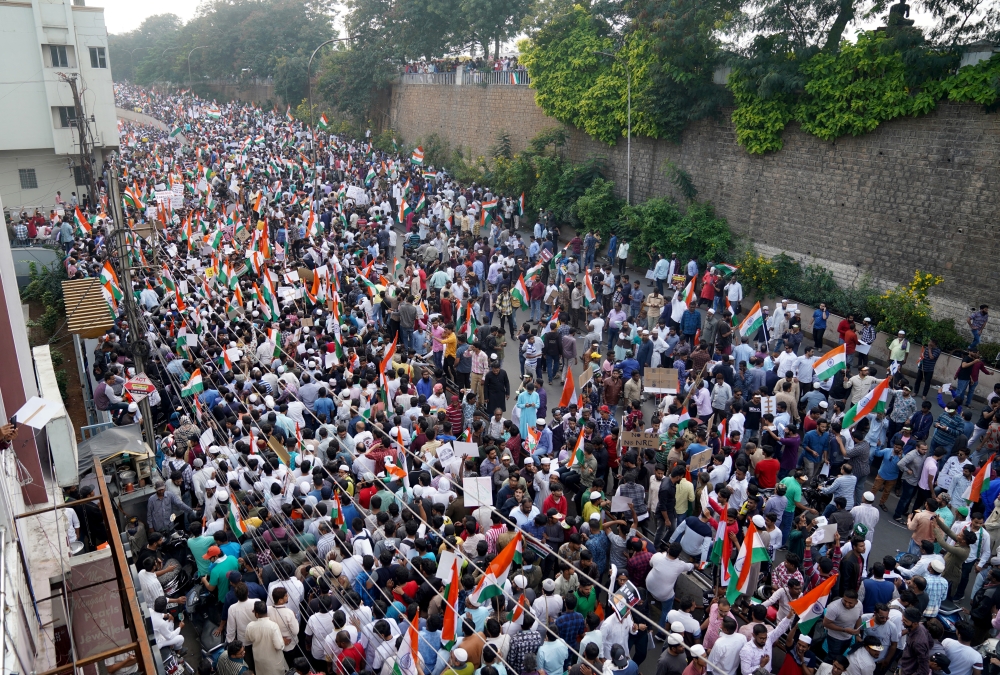 Demonstrators hold placards and flags as they attend a protest rally against a new citizenship law, in Hyderabad, India, January 4, 2020. REUTERS/Vinod Babu