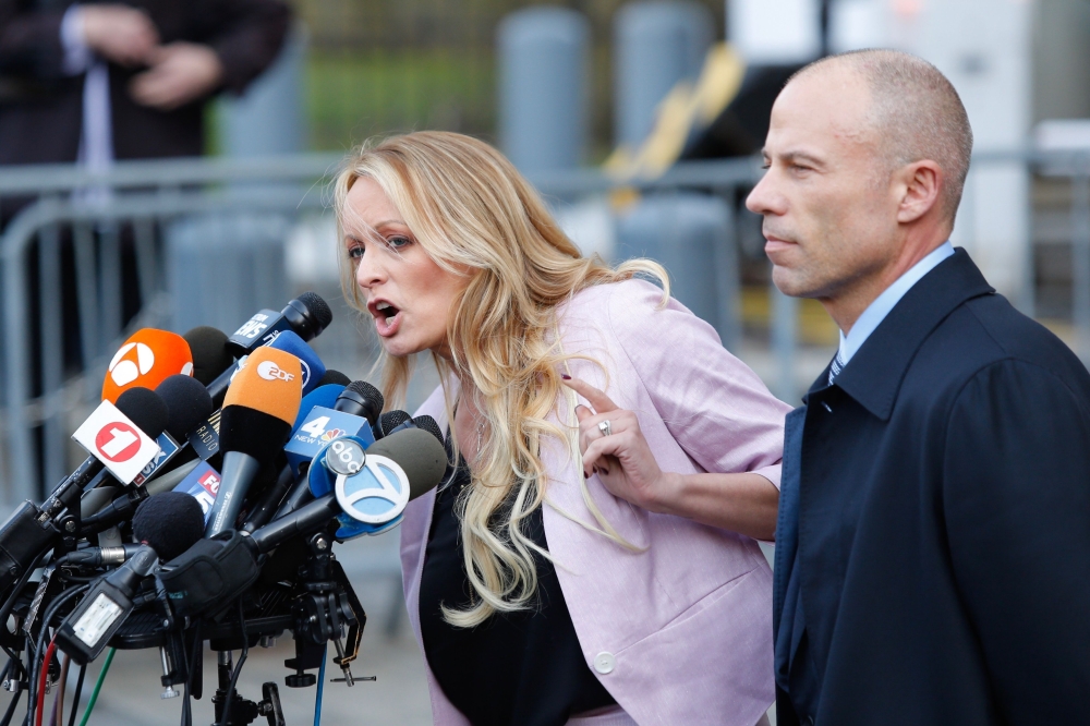 Lawyer Michael Avenatti looks on as Stephanie Clifford also known as Stormy Daniels speaks outside US Federal Court in Lower Manhattan on April 16, 2018. AFP / Eduardo Munoz Alvarez