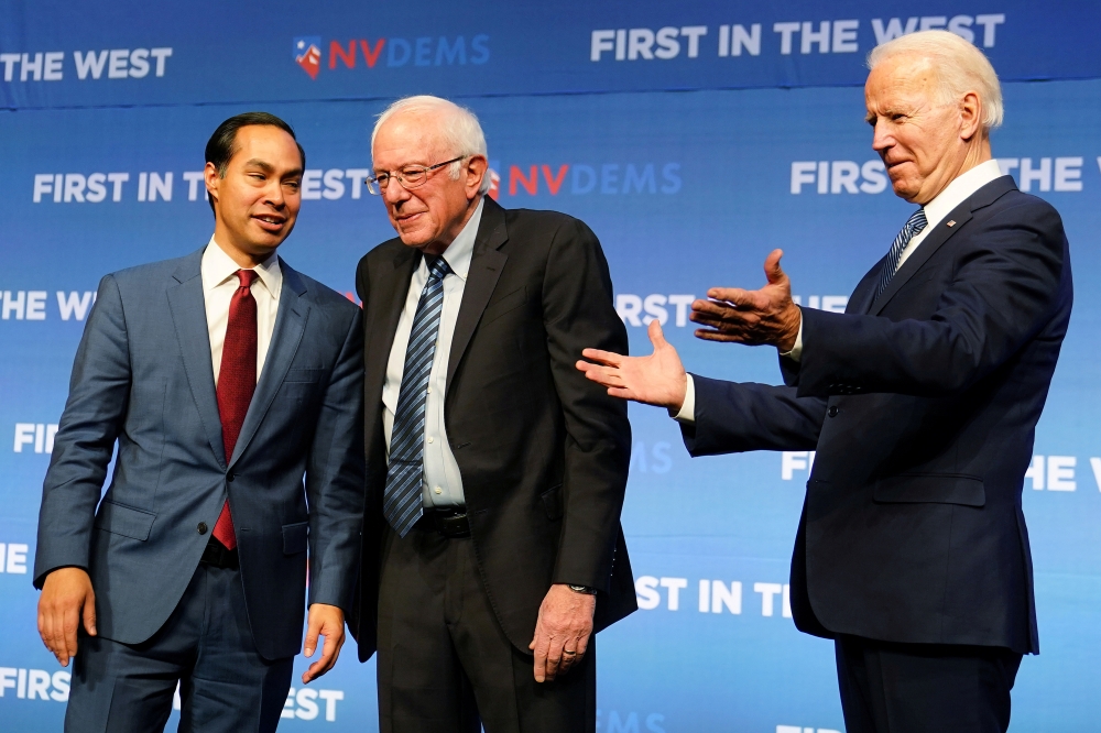 FILE PHOTO: Democratic US presidential candidates Julian Castro, Bernie Sanders and Joe Biden stand on stage at a First in the West Event at the Bellagio Hotel in Las Vegas, November 17, 2019. Reuters/Carlo Allegri
 
