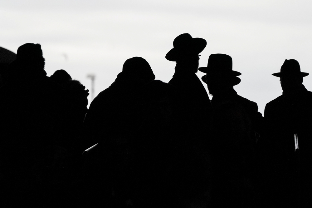 Orthodox Jews arrive during the 13th Siyum HaShas, a celebration marking the completion of the Daf Yomi, a seven-and-a-half-year cycle of studying texts from the Talmud, the canon of Jewish religious law, at the MetLife Stadium in East Rutherford, New Jer