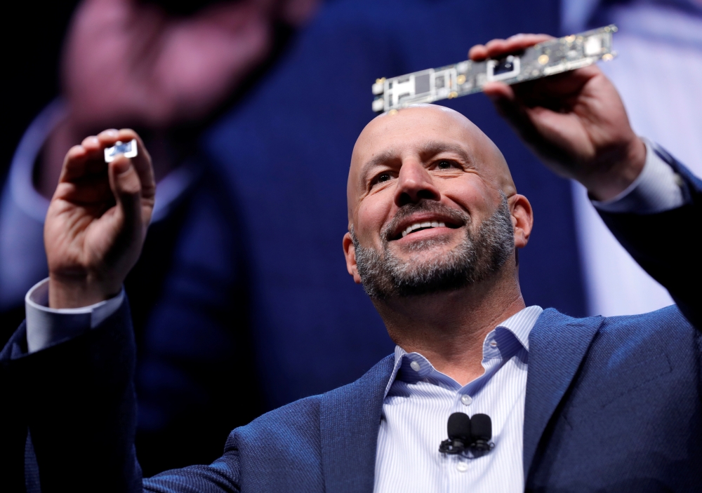 Gregory Bryant, executive vice president and general manager of the Client Computing Group at Intel, holds up a Tiger Lake chip and motherboard at an Intel news conference during the 2020 CES in Las Vegas, Nevada, U.S. January 6, 2020. Reuters/Steve Marcu