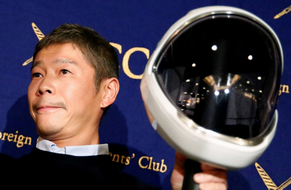 FILE PHOTO: Japanese billionaire Yusaku Maezawa, founder and chief executive of online fashion retailer Zozo at a news conference in Tokyo, Japan, October 9, 2018. REUTERS/Toru Hanai/File Photo