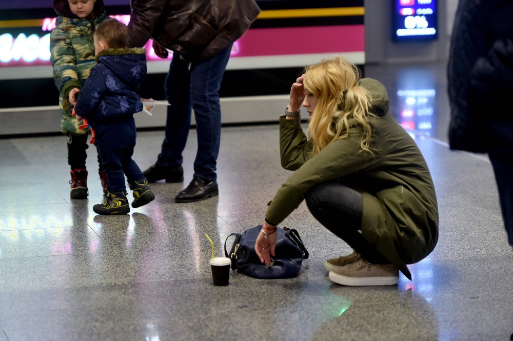 A women reacts at the arrival gate of the Boryspil airport outside Kiev on January 8, 2020. AFP / Sergei Supinsky 