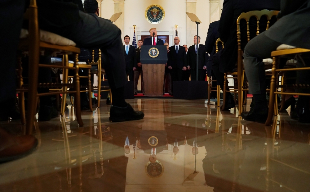 US President Donald Trump delivers a statement about Iran flanked by Secretary of Defense Mark Esper, Vice President Mike Pence, Secretary of State Mike Pompeo and military leaders in the Grand Foyer at the White House, January 8, 2020. Reuters/Kevin Lama