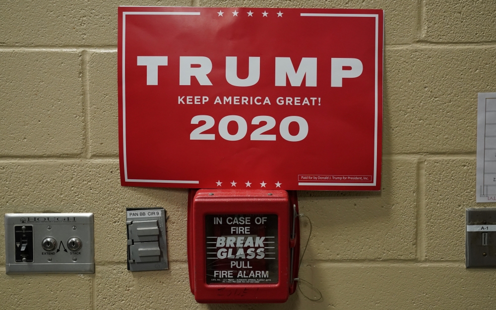 A Trump 2020 campaign poster is seen on a fir alarm during a campaign rally by Donald Trump in Fayetteville, North Carolina, US, September 9, 2019. Reuters / Kevin Lamarque