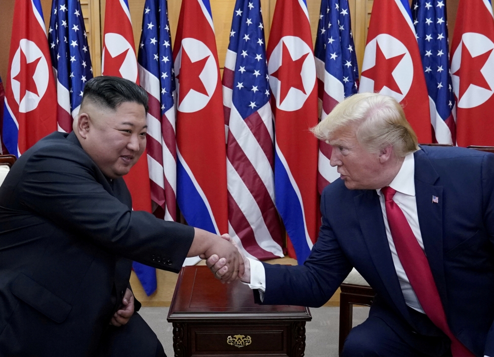 U.S. President Donald Trump meets with North Korean leader Kim Jong Un at the demilitarized zone separating the two Koreas, in Panmunjom, South Korea, June 30, 2019. REUTERS/Kevin Lamarque/File Photo
