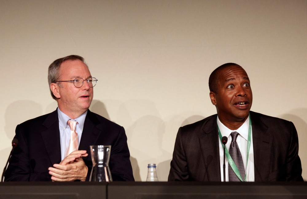 Google Executive Chairman Eric Schmidt (L) and David Drummond, Google's Senior Vice President of Corporate Development, react before a meeting about the 