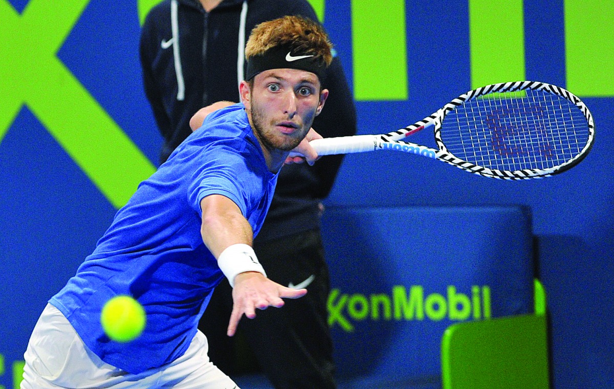 Corentin Moutet of France returns the ball to Stan Wawrinka of Switzerland during their semi-final match of Qatar ExxonMobil Open 2020 at the Khalifa International Tennis and Squash Complex in Doha yesterday. Corentin Moutet won the match and will take on