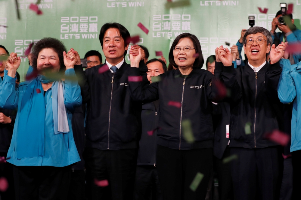 Presidential Office Secretary-General Chen Chu, Vice President-elect William Lai, incumbent Taiwan President Tsai Ing-wen and incumbent Vice President Chen Chien-jen celebrate at a rally after their election victory, outside the Democratic Progressive Par