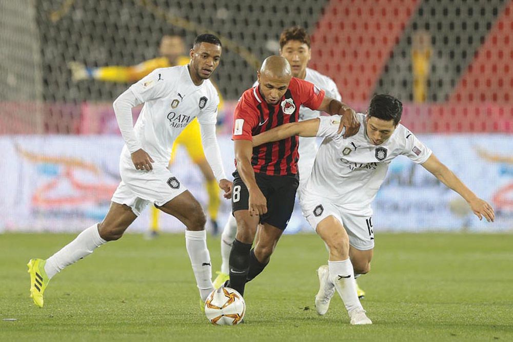 The players of Al Sadd and Al Rayyan vie for ball possession during the Qatar Cup semi-final match at Al Sadd Stadium yesterday.