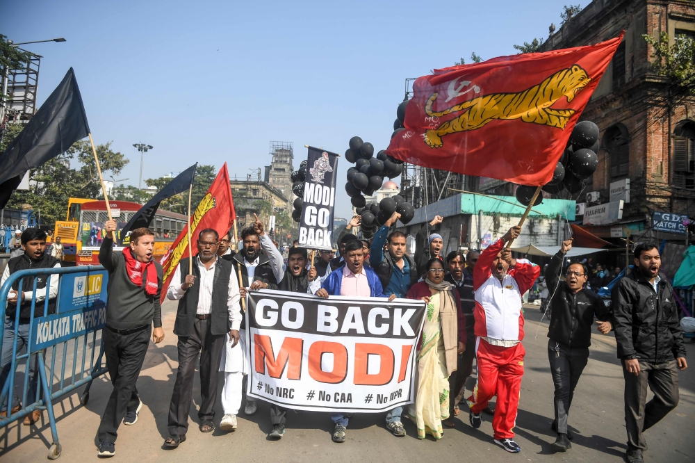 Demonstrators shout slogans to protest against Indian Prime Minister Narendra Modi, during a demonstration in Kolkata on January 12, 2020. AFP / Dibyangshu Sarkar 