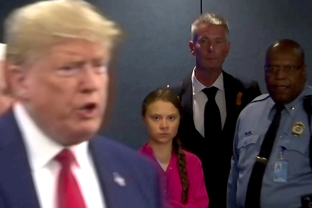 Greta Thunberg watches as US President Donald Trump enters the UN to speak with reporters in a still image from video taken in New York City, September 23, 2019. Reuters / Andrew Hofstetter