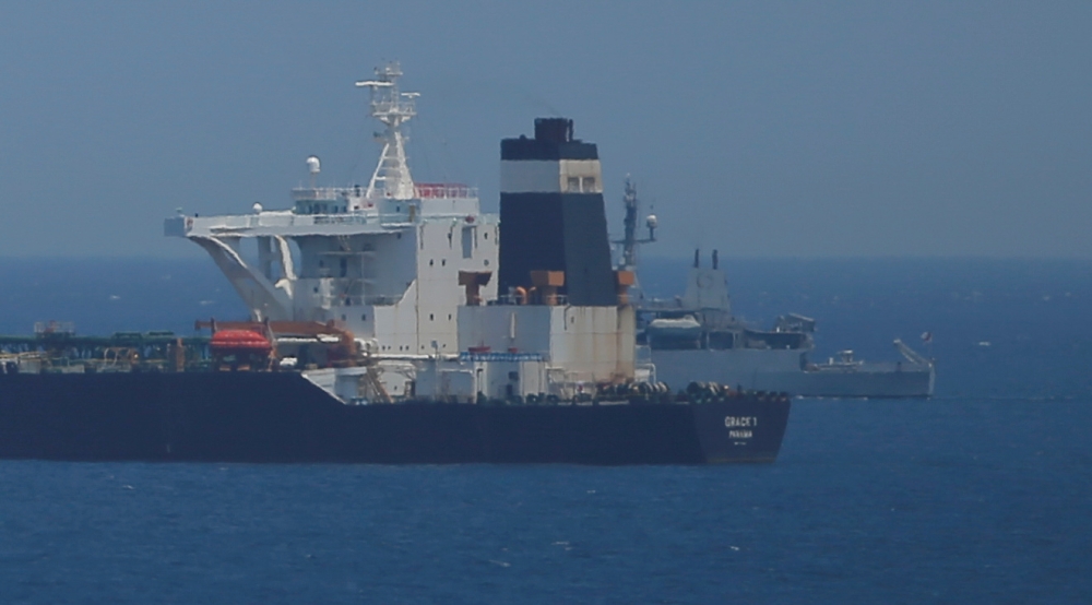 A British Royal Navy patrol vessel guards the oil supertanker Grace 1 as it sits anchored in waters of the British overseas territory of Gibraltar, July 4, 2019. Reuters / Jon Nazca
