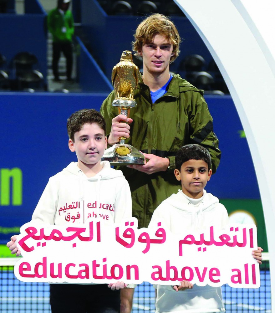 Russia's Andrey Rublev poses with the ball boys after winning the Qatar ExxonMobil Open final. Picture:  Salim Matramkot/The Peninsula