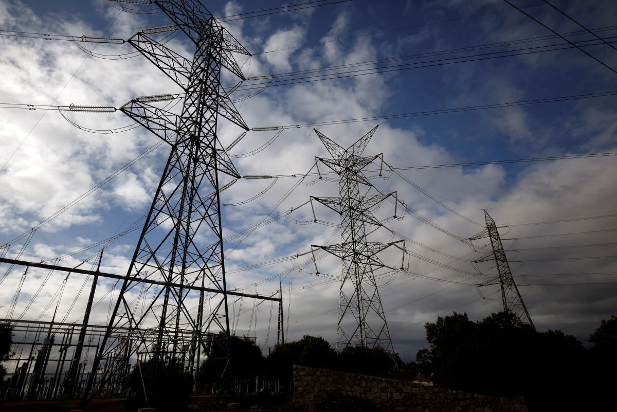 Electricity pylons of high-tension electricity power lines are seen in Galapagar, Spain, January 20, 2017. Reuters / Juan Medina