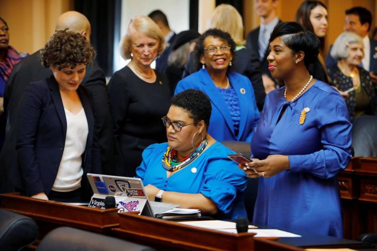 Democratic delegates including women and minorities congregate on the floor of the House as the General Assembly prepares to convene in Richmond, Virginia, U.S. January 8, 2020. Reuters/Jonathan Drake